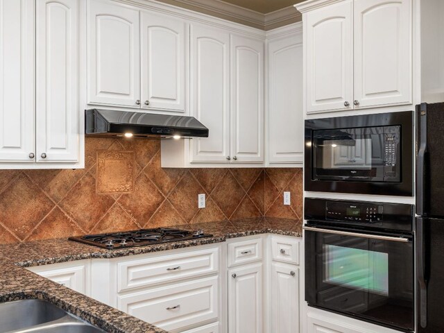 4914 Big Bend Trl, Georgetown, TX 78633 - kitchen with black appliances, under cabinet range hood, white cabinets, and ornamental molding