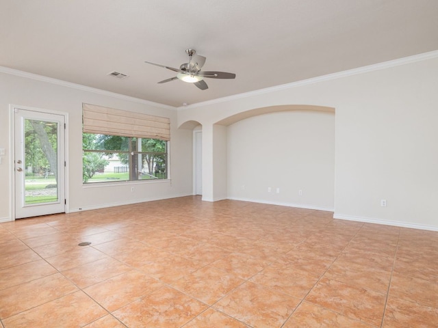 4914 Big Bend Trl, Georgetown, TX 78633 - spare room with crown molding, ceiling fan, light tile patterned flooring, arched walkways, and baseboards