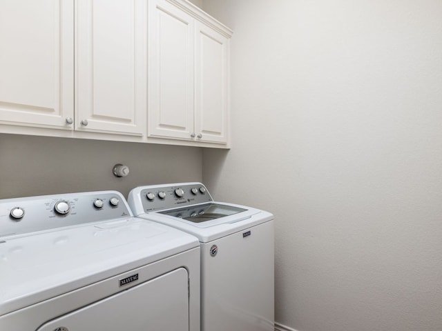 4914 Big Bend Trl, Georgetown, TX 78633 - laundry area with washing machine and dryer and cabinet space
