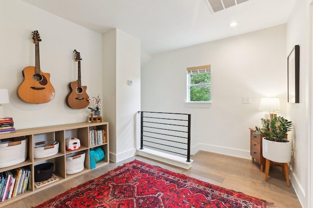 6505 Grover Ave Unit 1, Austin, TX 78757 - living area featuring wood finished floors, baseboards, and recessed lighting