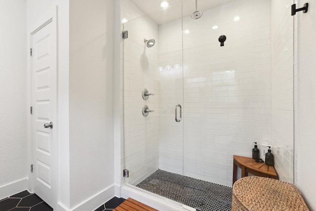 6505 Grover Ave Unit 1, Austin, TX 78757 - full bathroom with a shower stall, baseboards, and tile patterned flooring
