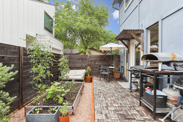 6505 Grover Ave Unit 1, Austin, TX 78757 - view of patio featuring a garden
