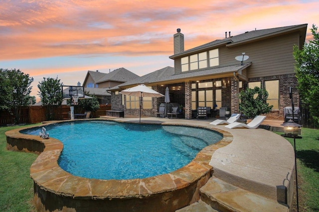 2513 Rusty Spur, Leander, TX 78641 - pool at dusk featuring a patio and a fenced backyard