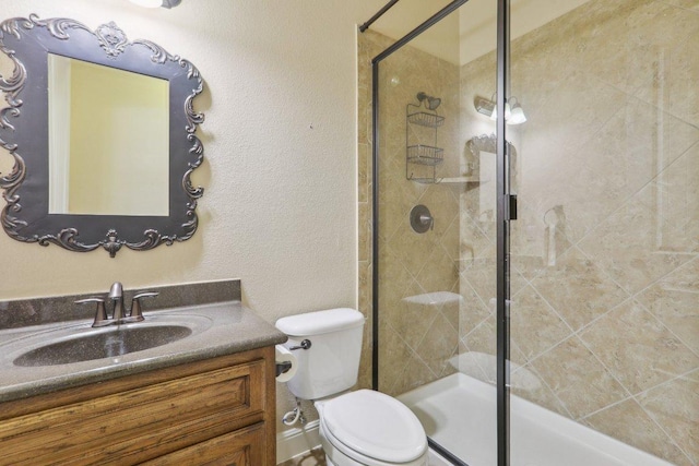 2513 Rusty Spur, Leander, TX 78641 - bathroom featuring vanity, a shower stall, and toilet