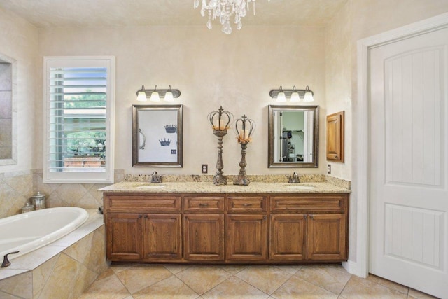 2513 Rusty Spur, Leander, TX 78641 - bathroom with double vanity, a bath, a chandelier, and tile patterned flooring