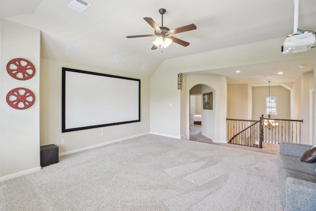 2513 Rusty Spur, Leander, TX 78641 - carpeted home theater room with lofted ceiling, arched walkways, a chandelier, baseboards, and ceiling fan