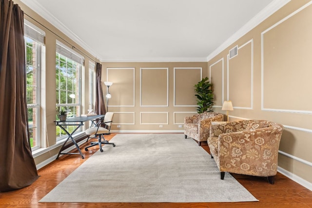 10617 Bramblecrest Dr, Austin, TX 78726 - sitting room with a decorative wall, ornamental molding, wood finished floors, an office area, and baseboards
