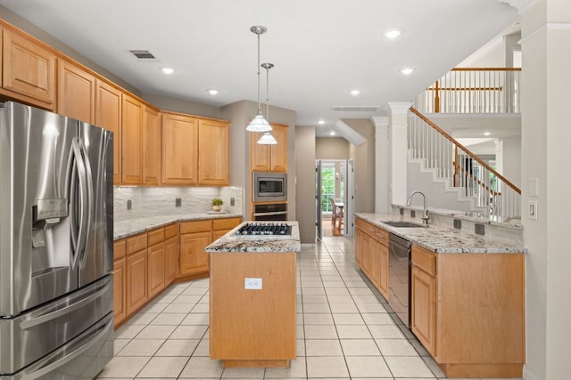 10617 Bramblecrest Dr, Austin, TX 78726 - kitchen with stainless steel appliances, a sink, a center island, decorative backsplash, and light stone counters