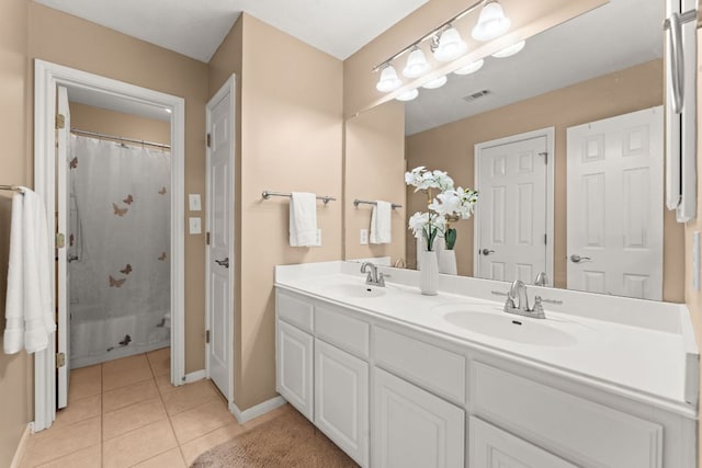 10617 Bramblecrest Dr, Austin, TX 78726 - full bathroom featuring double vanity, baseboards, tile patterned flooring, and a shower with shower curtain