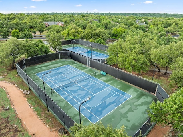 10617 Bramblecrest Dr, Austin, TX 78726 - view of tennis court featuring a wooded view