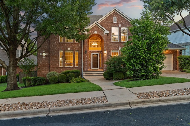 10617 Bramblecrest Dr, Austin, TX 78726 - traditional home with brick siding, a yard, concrete driveway, and an attached garage