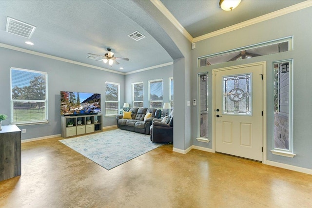 141 N Buckhorn Dr, Bastrop, TX 78602 - entrance foyer with finished concrete floors, baseboards, arched walkways, ornamental molding, and a ceiling fan