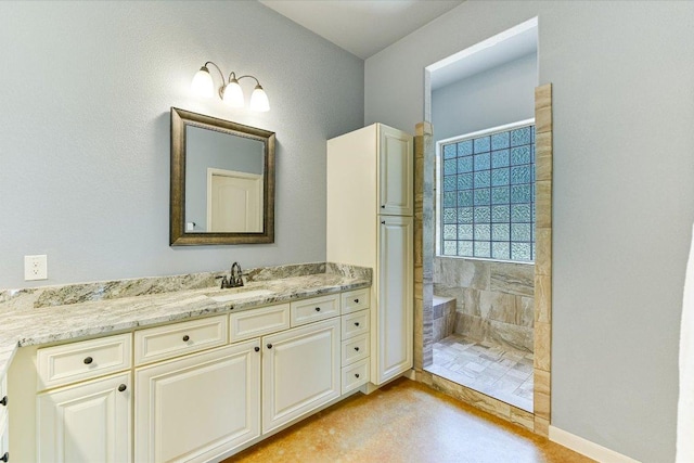 141 N Buckhorn Dr, Bastrop, TX 78602 - bathroom with tiled shower and vanity