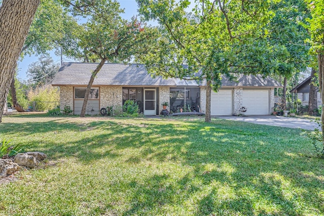 9206 Robins Nest Ln, Austin, TX 78729 - view of front of house with an attached garage, concrete driveway, stone siding, and a shingled roof