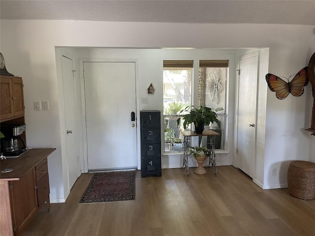 9206 Robins Nest Ln, Austin, TX 78729 - entryway featuring wood finished floors and baseboards