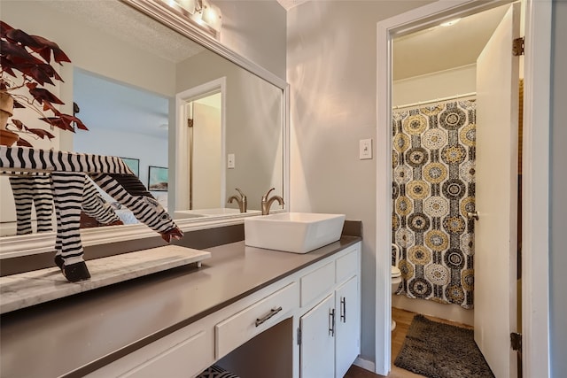 9206 Robins Nest Ln, Austin, TX 78729 - bathroom with vanity and wood finished floors
