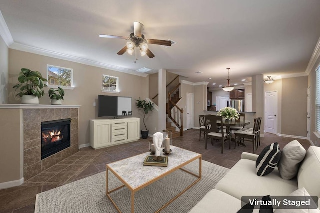 11000 Anderson Mill Rd Unit 96, Austin, TX 78750 - living area with ornamental molding, stairway, baseboards, ceiling fan, and a fireplace