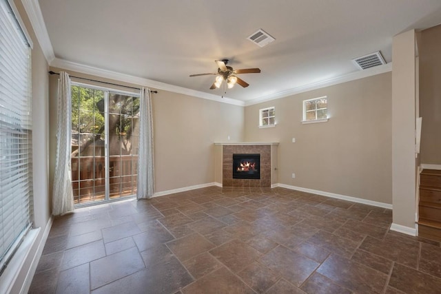 11000 Anderson Mill Rd Unit 96, Austin, TX 78750 - unfurnished living room with stone tile floors, ceiling fan, ornamental molding, a tiled fireplace, and baseboards