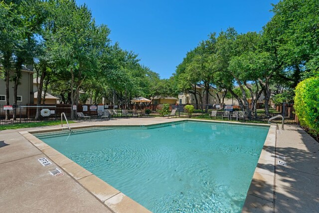 11000 Anderson Mill Rd Unit 96, Austin, TX 78750 - community pool featuring a patio area