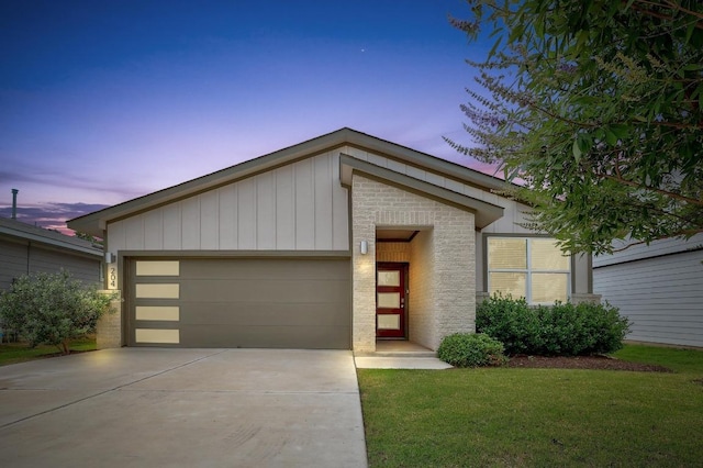204 Shawi Pass, Leander, TX 78641 - view of front of home featuring driveway, a garage, and a yard