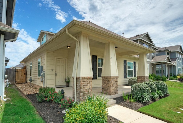 211 S Timber Brook Dr, Hutto, TX 78634 - view of front of home featuring a porch and a gate
