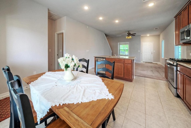 211 S Timber Brook Dr, Hutto, TX 78634 - dining space featuring baseboards, a ceiling fan, recessed lighting, light carpet, and light tile patterned floors