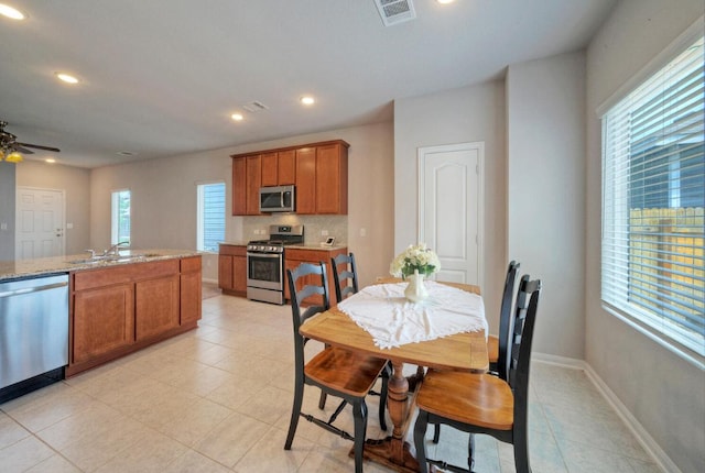 211 S Timber Brook Dr, Hutto, TX 78634 - dining area featuring light tile patterned floors, recessed lighting, and a ceiling fan