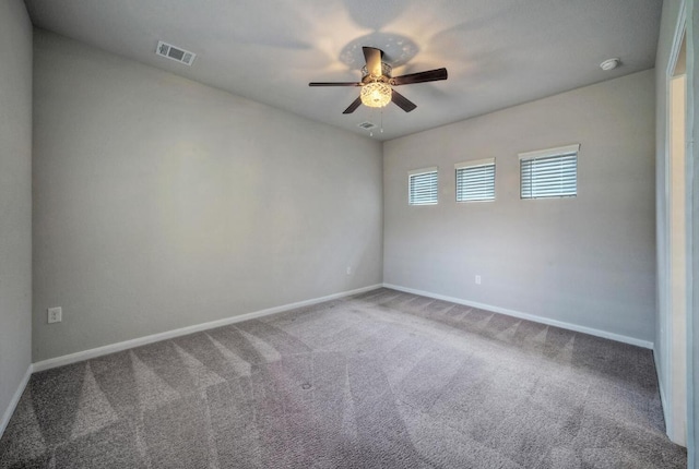 211 S Timber Brook Dr, Hutto, TX 78634 - empty room featuring a ceiling fan, carpet floors, and a smoke detector