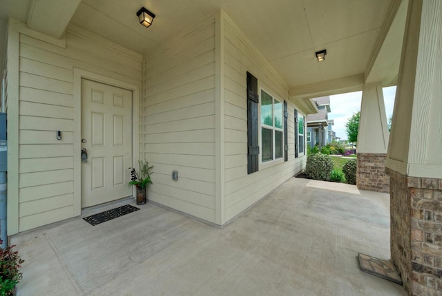 211 S Timber Brook Dr, Hutto, TX 78634 - view of exterior entry featuring covered porch