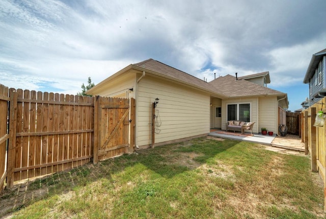 211 S Timber Brook Dr, Hutto, TX 78634 - rear view of house featuring a patio and a gate