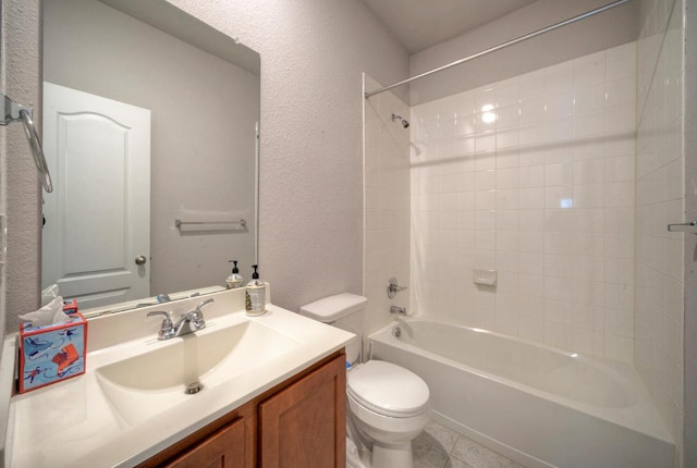 211 S Timber Brook Dr, Hutto, TX 78634 - bathroom featuring toilet, vanity, shower / bath combination, a textured wall, and tile patterned floors