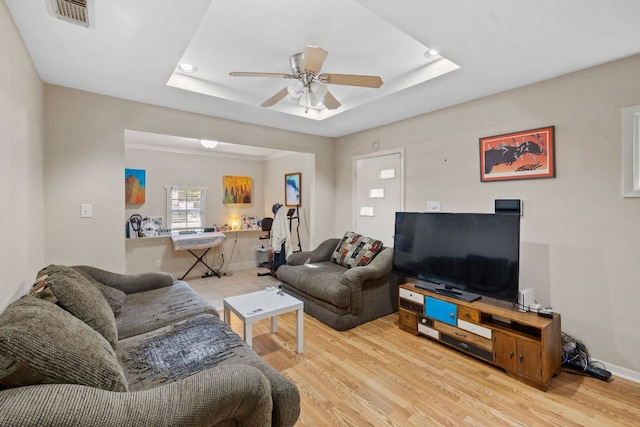 6805 Tulane Dr, Austin, TX 78723 - living area featuring a ceiling fan, a raised ceiling, light wood-type flooring, baseboards, and recessed lighting