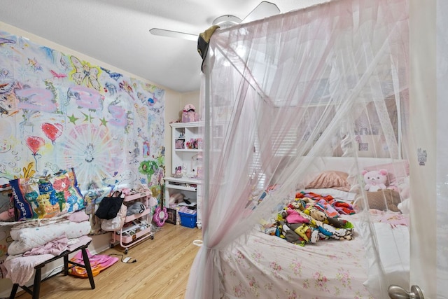 6805 Tulane Dr, Austin, TX 78723 - bedroom with wood finished floors and a ceiling fan