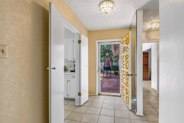 8600 Crest Ridge Cir, Austin, TX 78750 - entryway with a textured ceiling and light tile patterned flooring