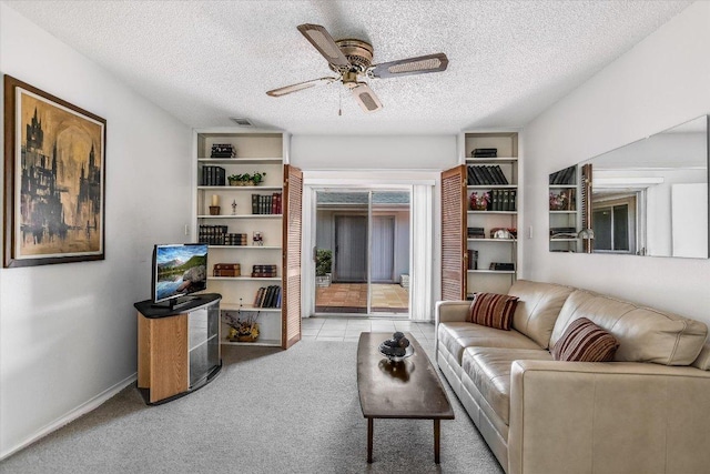 8600 Crest Ridge Cir, Austin, TX 78750 - living room featuring ceiling fan, carpet flooring, and a textured ceiling
