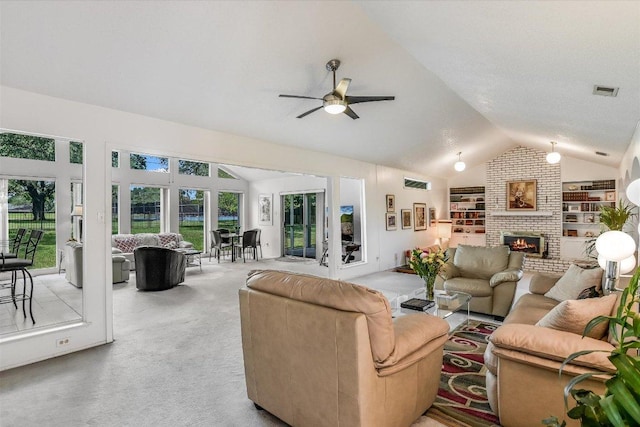 8600 Crest Ridge Cir, Austin, TX 78750 - carpeted living area featuring vaulted ceiling, ceiling fan, built in features, and a brick fireplace