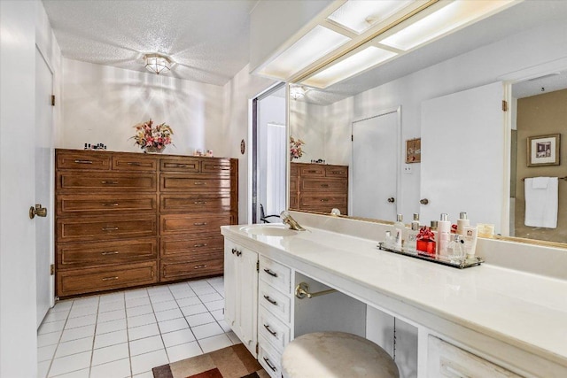 8600 Crest Ridge Cir, Austin, TX 78750 - full bath featuring vanity, tile patterned flooring, and a textured ceiling
