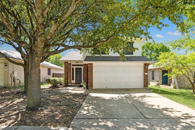 14321 Harcourt House Ln, Pflugerville, TX 78660 - view of front of house featuring concrete driveway, brick siding, an attached garage, and roof with shingles