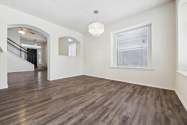 14321 Harcourt House Ln, Pflugerville, TX 78660 - empty room featuring wood finished floors, a chandelier, baseboards, stairs, and a ceiling fan