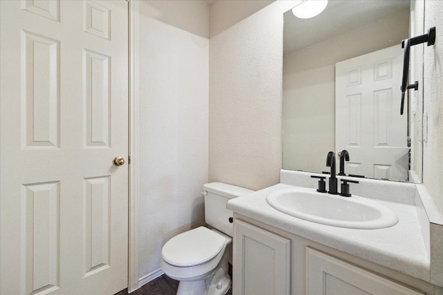 14321 Harcourt House Ln, Pflugerville, TX 78660 - half bathroom with vanity, toilet, and a textured wall