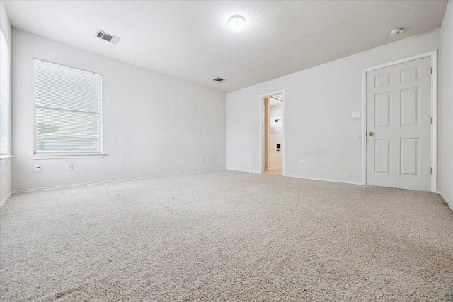 14321 Harcourt House Ln, Pflugerville, TX 78660 - spare room featuring carpet floors and baseboards
