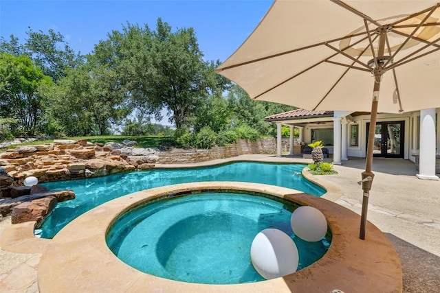 2404 University Club Dr, Austin, TX 78732 - view of swimming pool featuring french doors, a patio, and a pool with connected hot tub