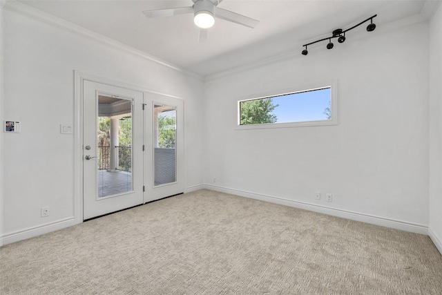2404 University Club Dr, Austin, TX 78732 - carpeted empty room with crown molding, a ceiling fan, and baseboards