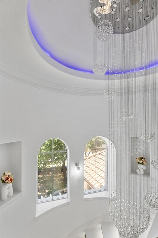 2404 University Club Dr, Austin, TX 78732 - detailed view of a chandelier and crown molding