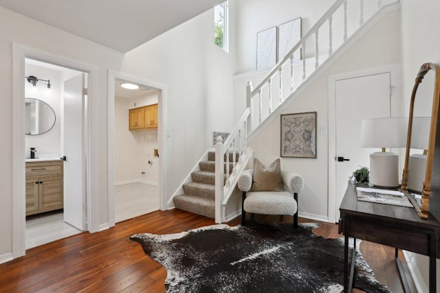 6029 Mount Bonnell Cv, Austin, TX 78731 - entryway featuring stairway, wood finished floors, and a towering ceiling