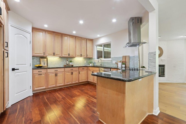 6029 Mount Bonnell Cv, Austin, TX 78731 - kitchen featuring island exhaust hood, dark wood-style flooring, a peninsula, dishwasher, and tasteful backsplash
