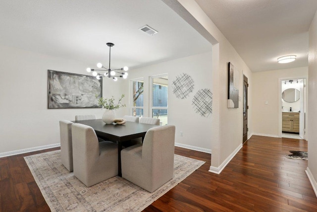 6029 Mount Bonnell Cv, Austin, TX 78731 - dining room with a chandelier and wood finished floors