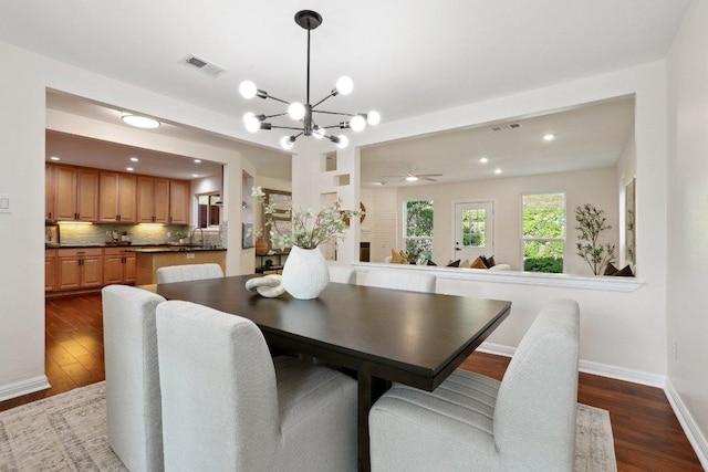 6029 Mount Bonnell Cv, Austin, TX 78731 - dining room featuring dark wood finished floors, a chandelier, and recessed lighting