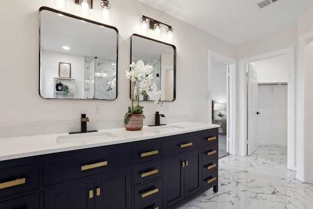 6029 Mount Bonnell Cv, Austin, TX 78731 - bathroom featuring double vanity, marble finish flooring, a walk in closet, and a marble finish shower