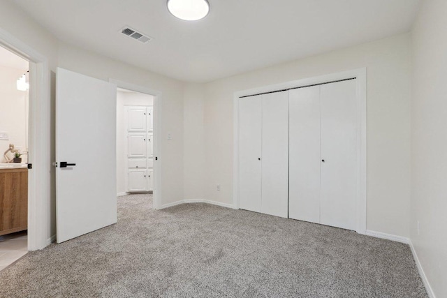 6029 Mount Bonnell Cv, Austin, TX 78731 - unfurnished bedroom with carpet flooring, a closet, and connected bathroom
